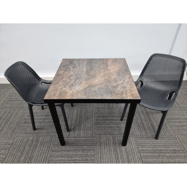 urban rust table with 2 Cruz black chairs