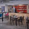 "Manhattan-Rectangle-Dining-and-Poseur-heights-with-Ultratop-Compact-Laminate-Vintage-Wood-top-and-Fresco-Black-Side-Chairs-1.jpg"