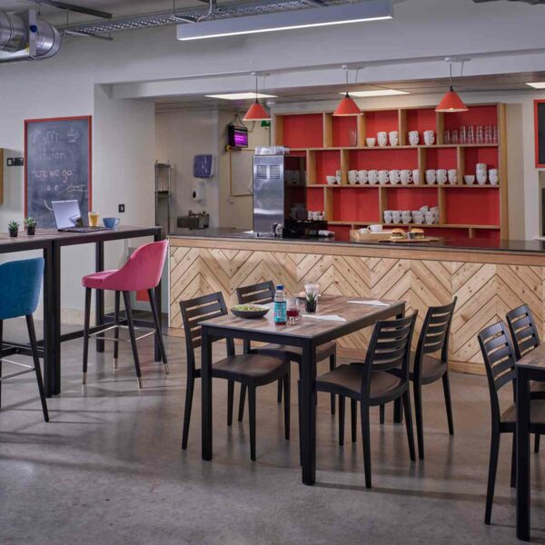 "Manhattan-Rectangle-Dining-and-Poseur-heights-with-Ultratop-Compact-Laminate-Vintage-Wood-top-and-Fresco-Black-Side-Chairs-1.jpg"